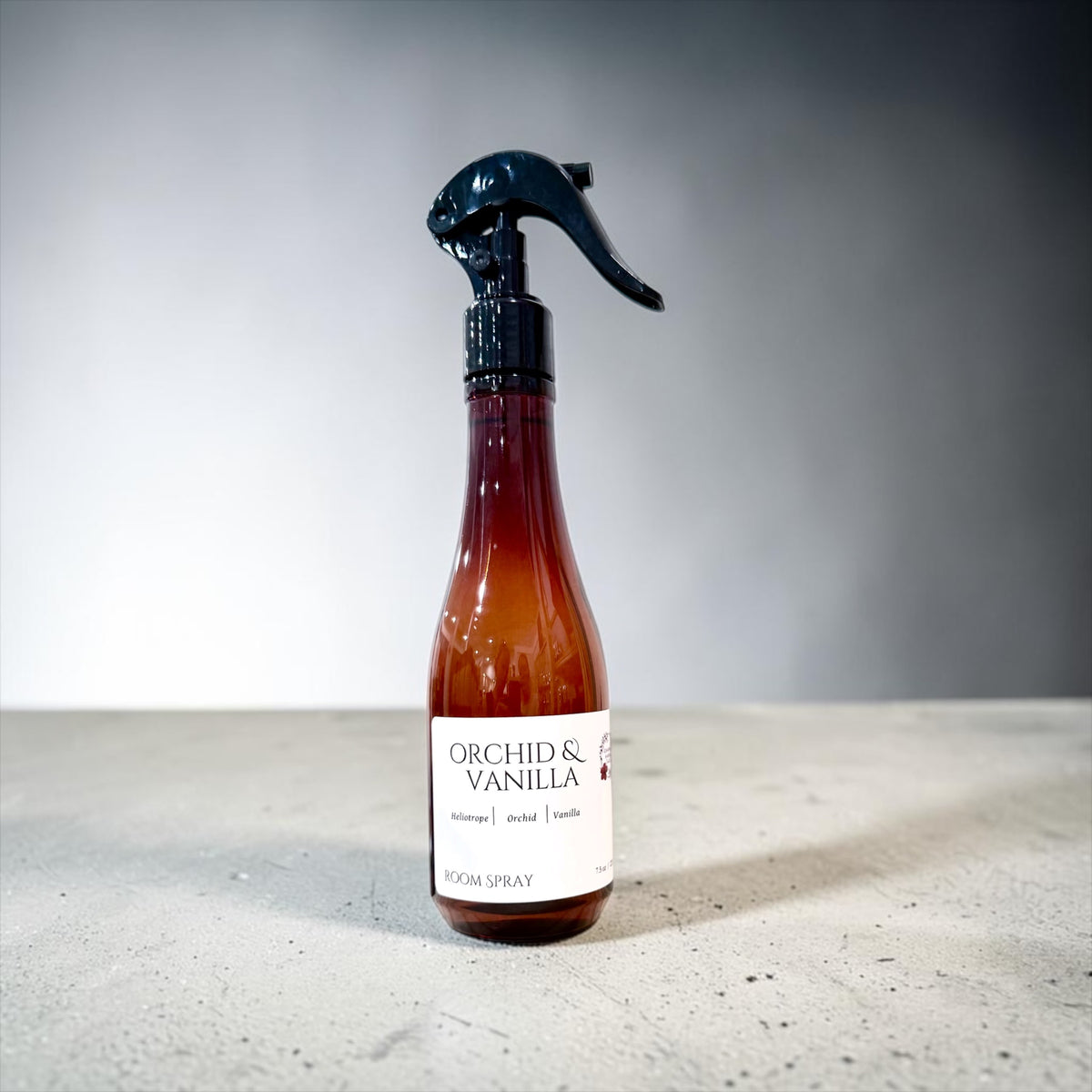 Orchid & Vanilla room spray bottle on a marble surface