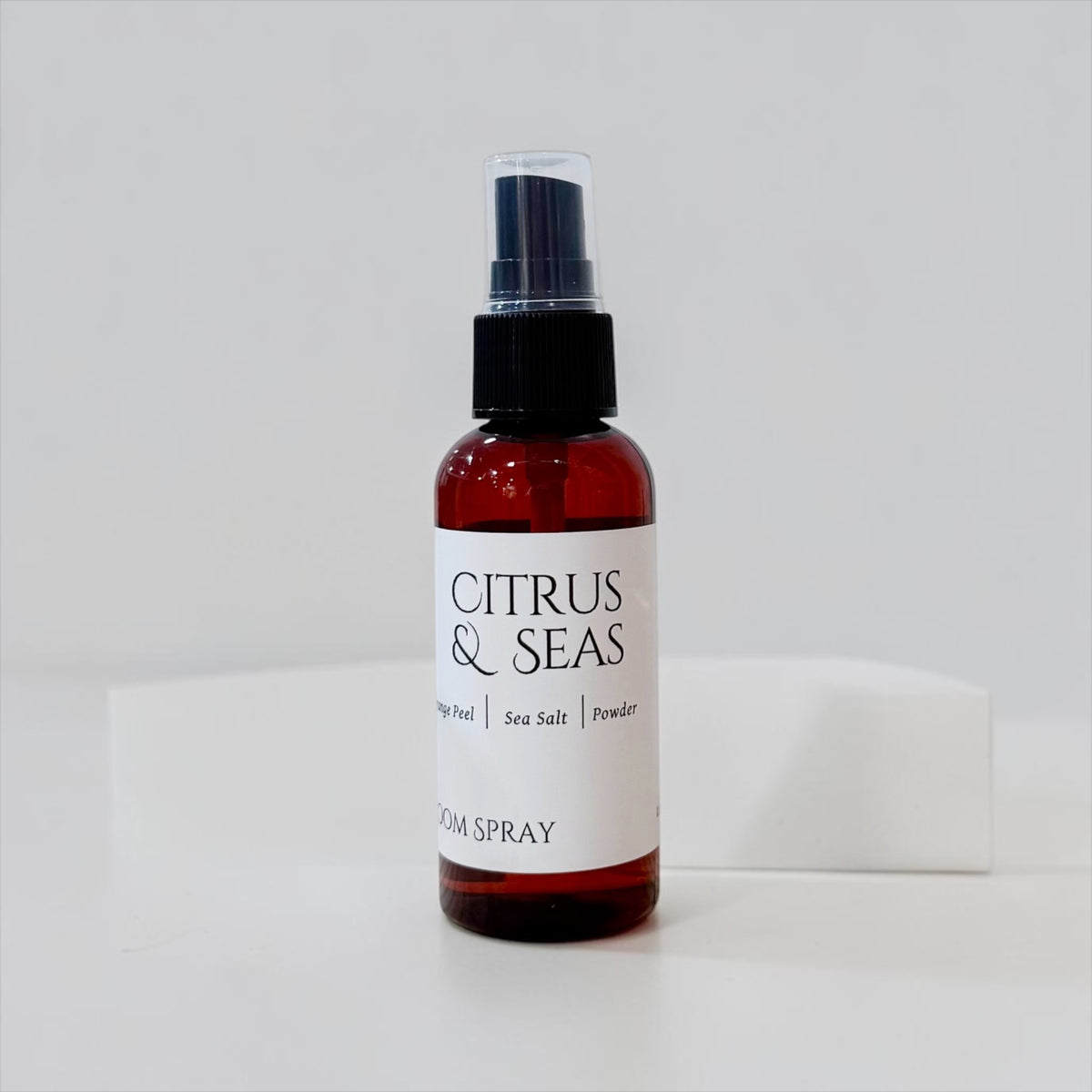 Citrus & Seas room spray bottle with pump top on a white background