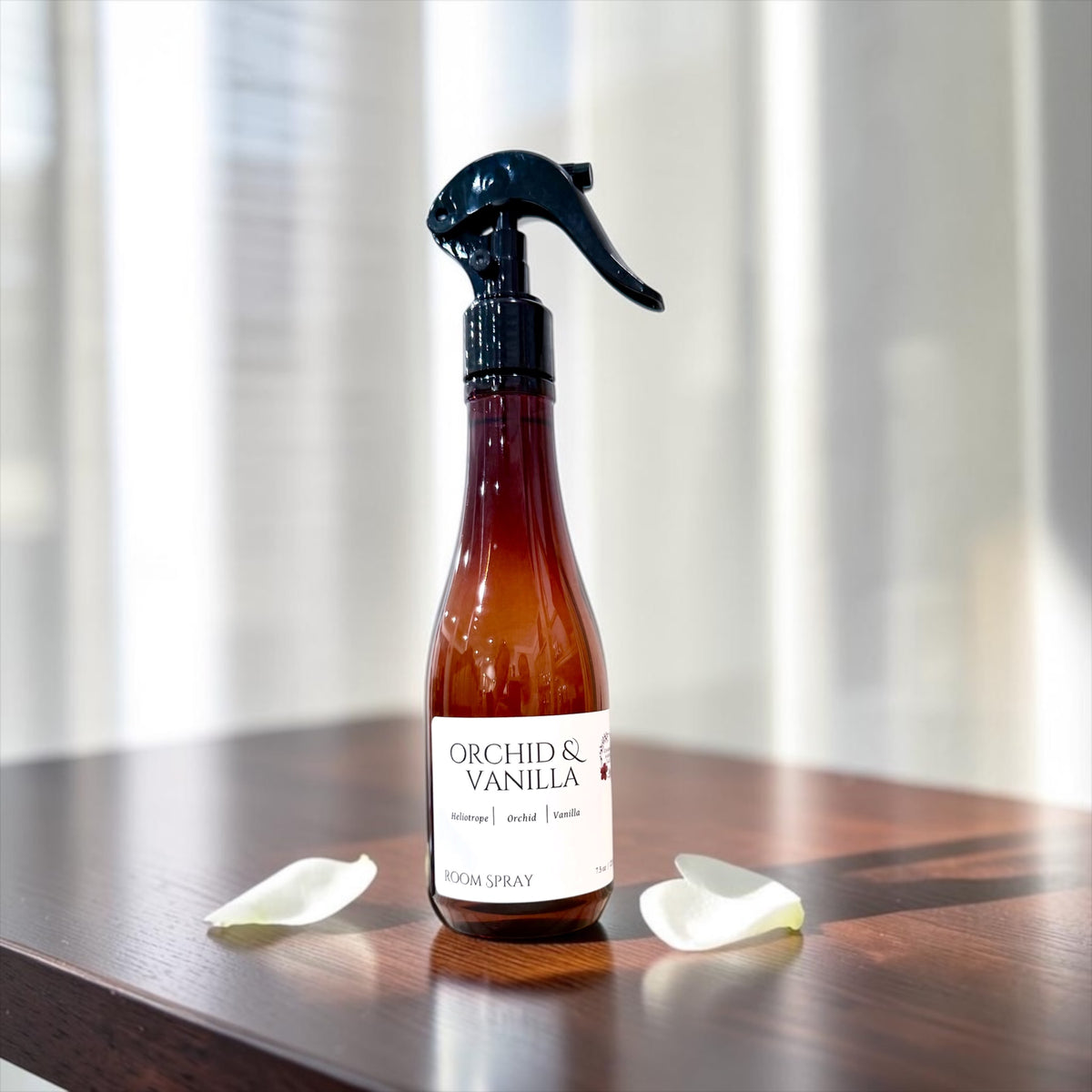 Orchid & Vanilla room spray bottle on a white background