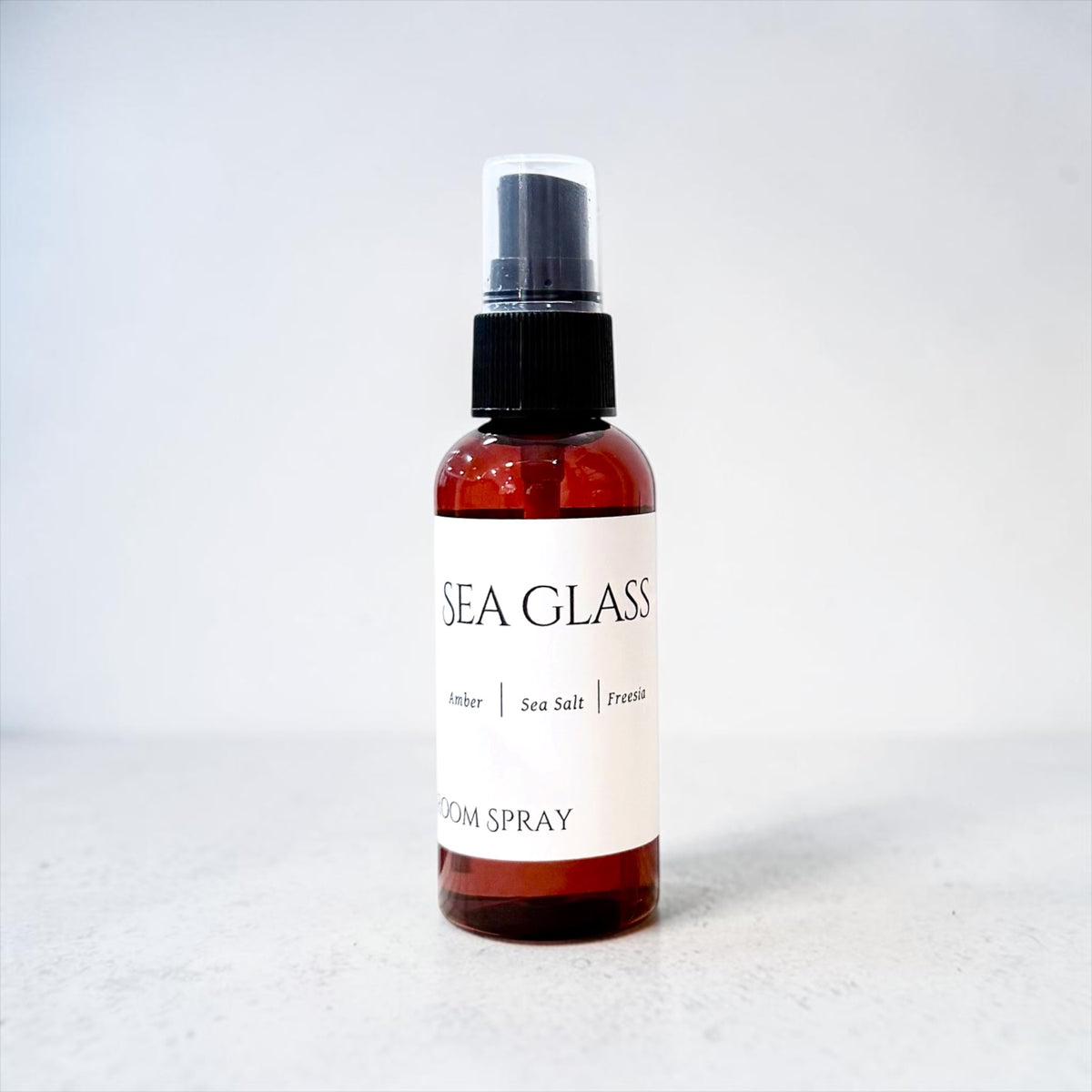 Sea Glass room spray bottle on a white background
