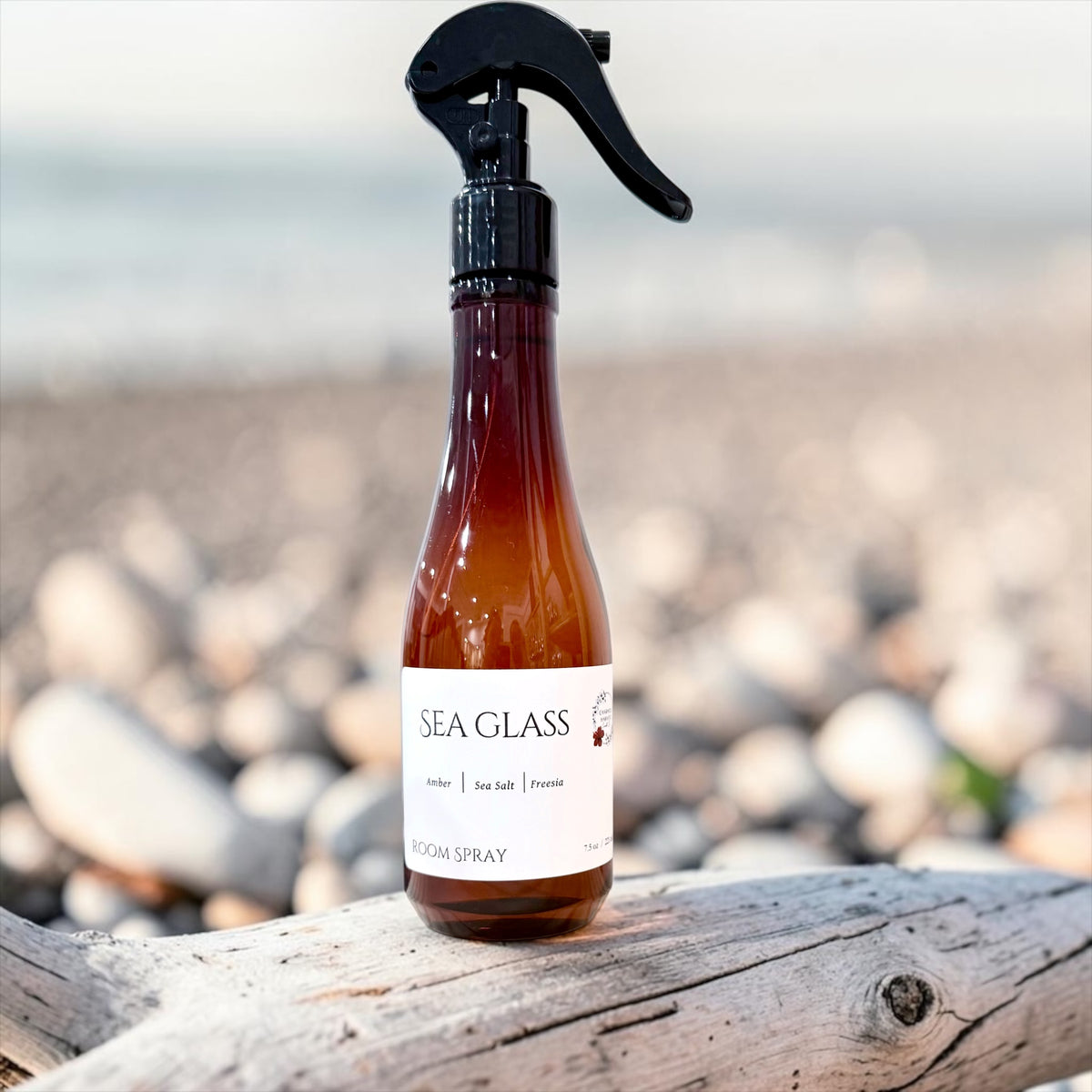Sea Glass room spray bottle on a weathered wood plank