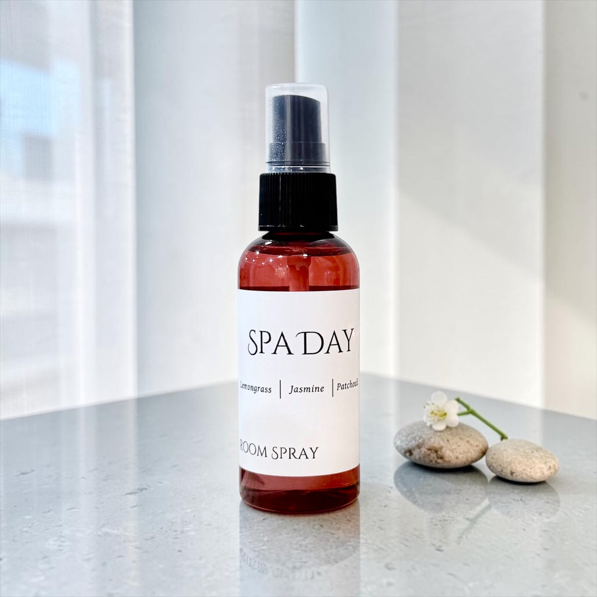 Spa Day room spray bottle on a stone counter with a spa towel