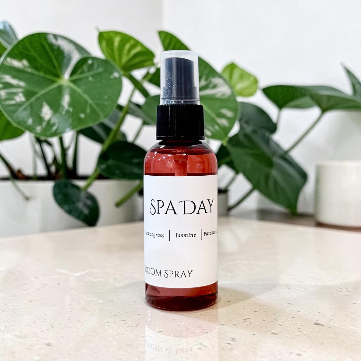 Spa Day room spray bottle with green plant leaves