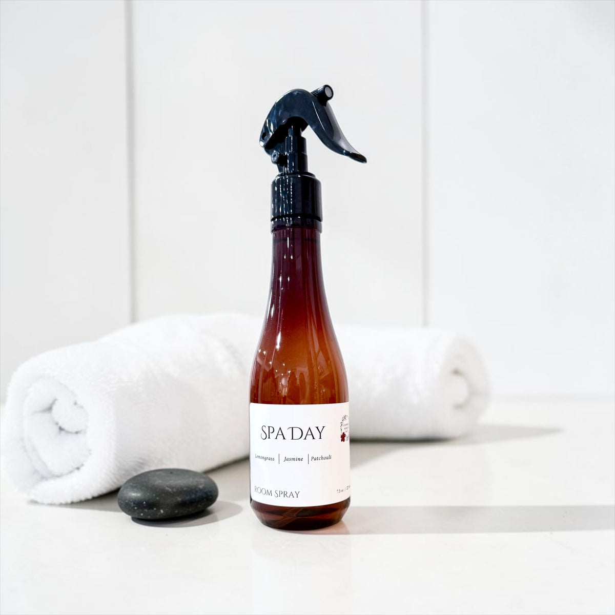 Spa Day room spray bottle with a rolled white spa towel