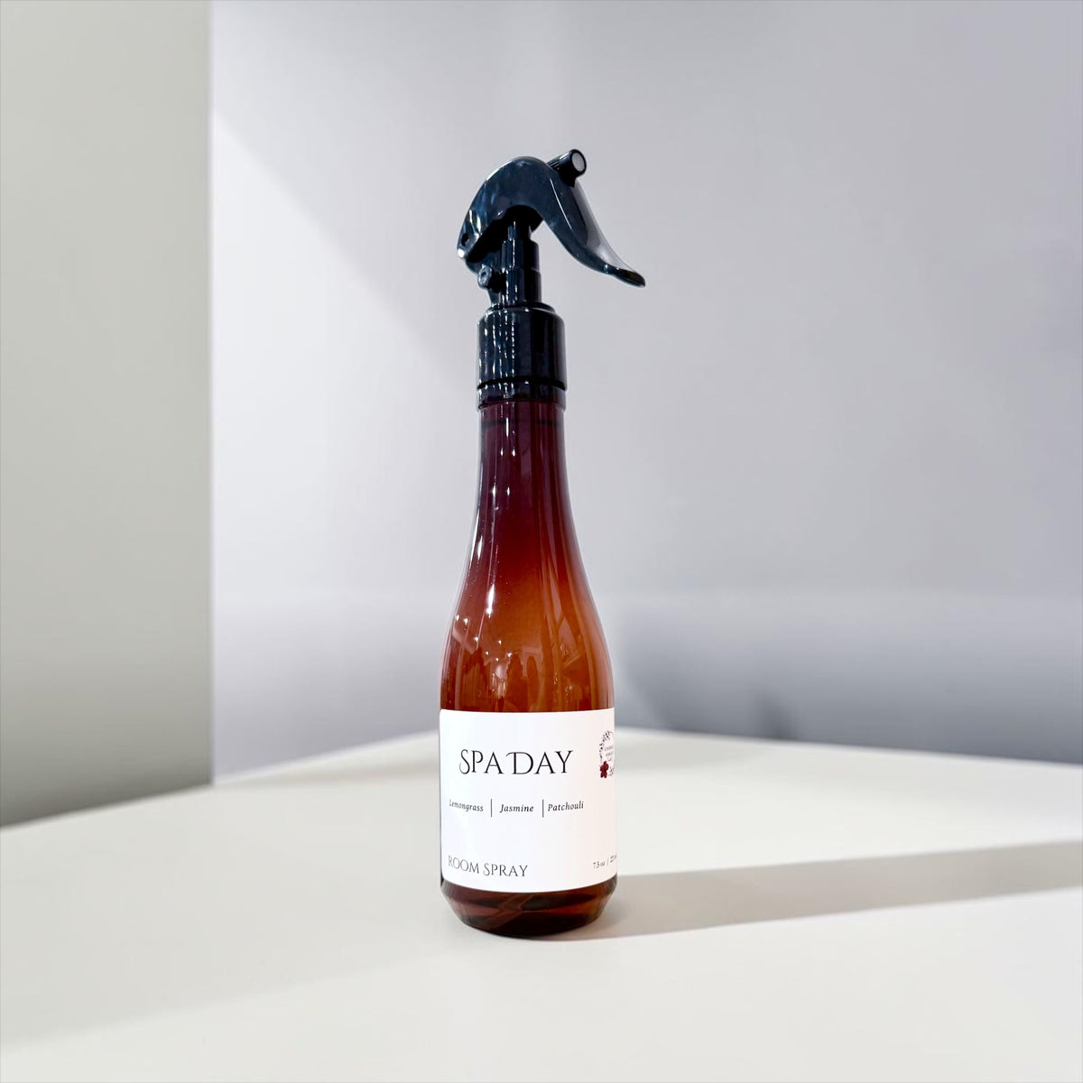 Spa Day room spray bottle on a soft gray background